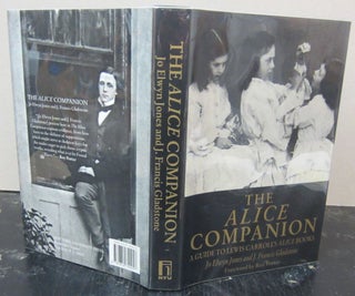 Item #73005 The Alice Companion: a Guide to Lewis Carroll's Alice Books. Jo Elwyn Jones And J....